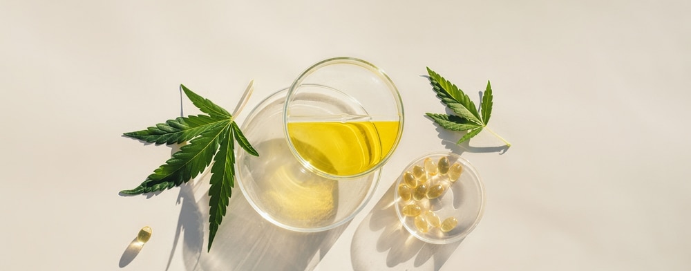 Hemp,Leaves,,Cbd,Oil,And,Cannabidiol,Capsules,,Natural,Cosmetic,Background